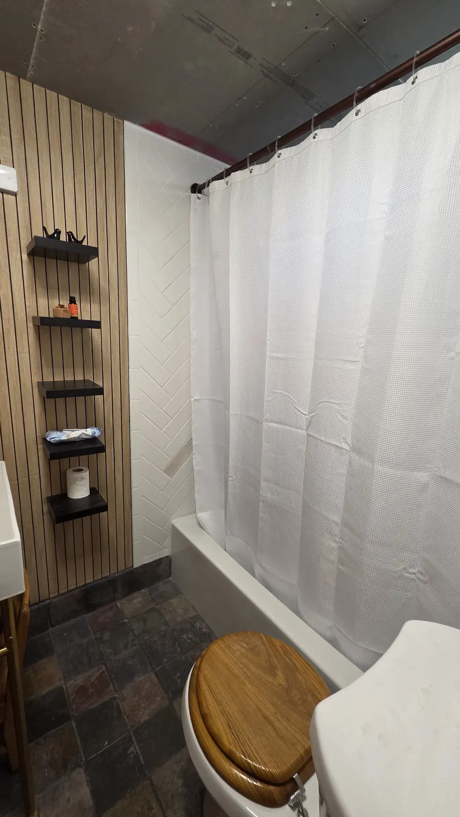 Ugly Kitchen bathroom with vanity and slate tile floor