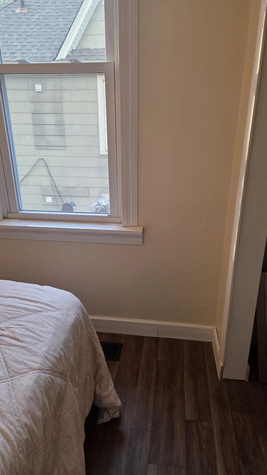 Ugly Kitchen bedroom with wood accent wall and window