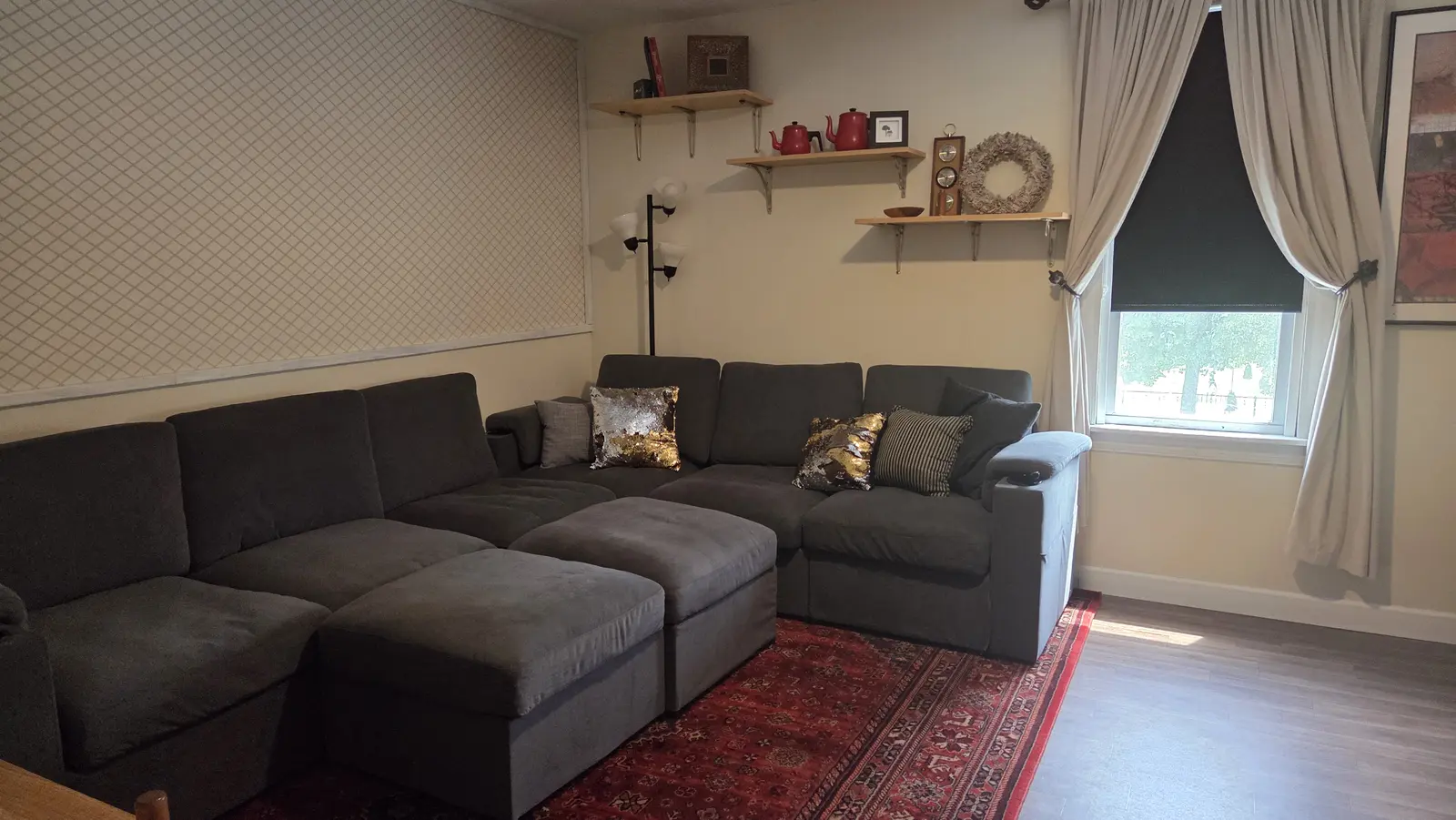 Ugly Kitchen living room with sectional and gold accent pillows